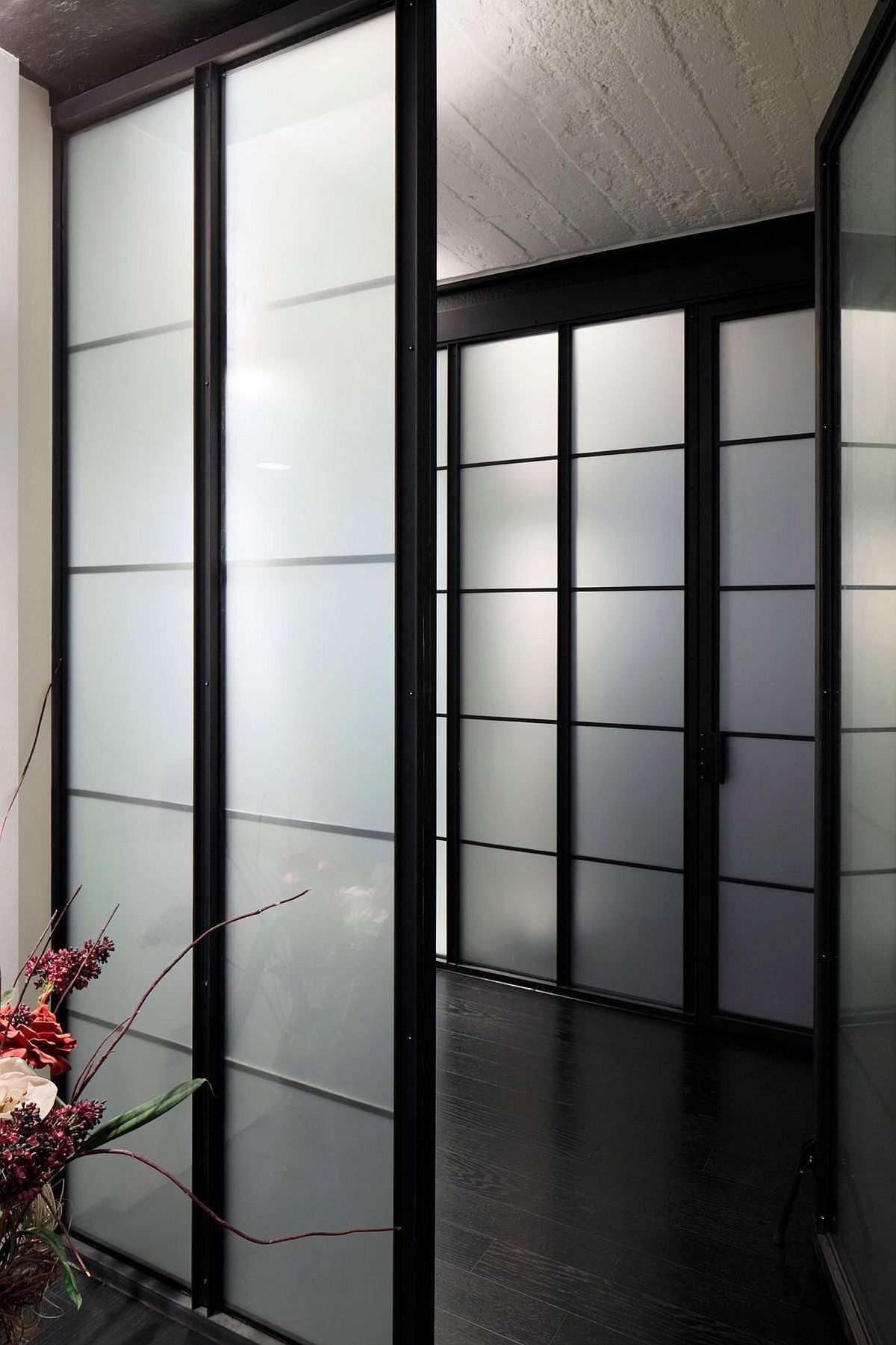 Translucent screens with dark, metallic frame allow light to fliter through