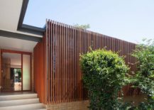 Vertical-slatted-timber-elements-give-the-street-facade-ample-privacy-217x155