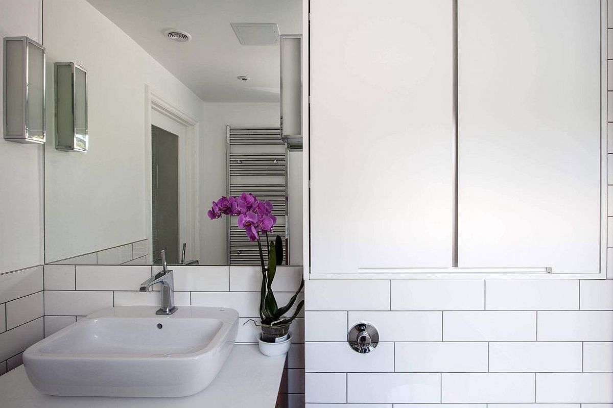 White contemporary bathroom enlivened with a hint of green and color
