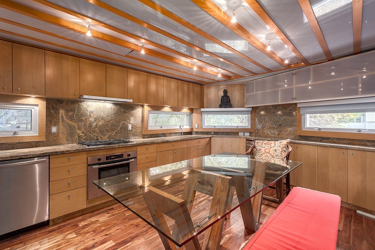 Wooden and glass shelves add additional storage space to the kitchen