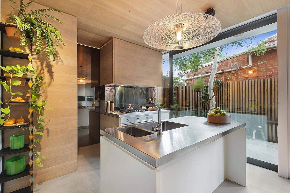 Wooden cabinetry adds additional storage space in the kitchen