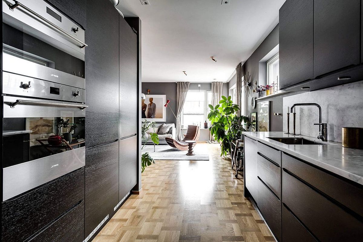 Wooden cabinets and marble countertops bring in textural contrast