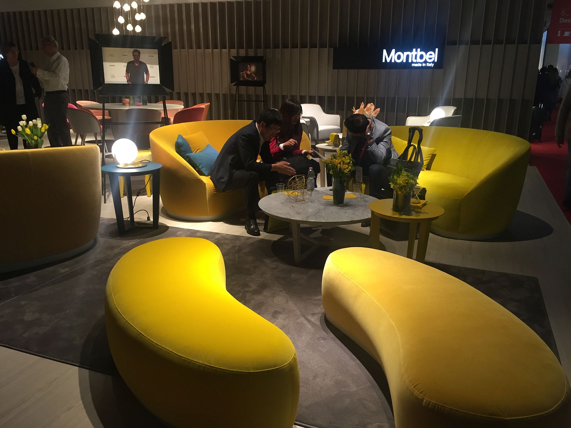 Yellow living room sofas coupled with smart modular setaing that doubles as a coffee table