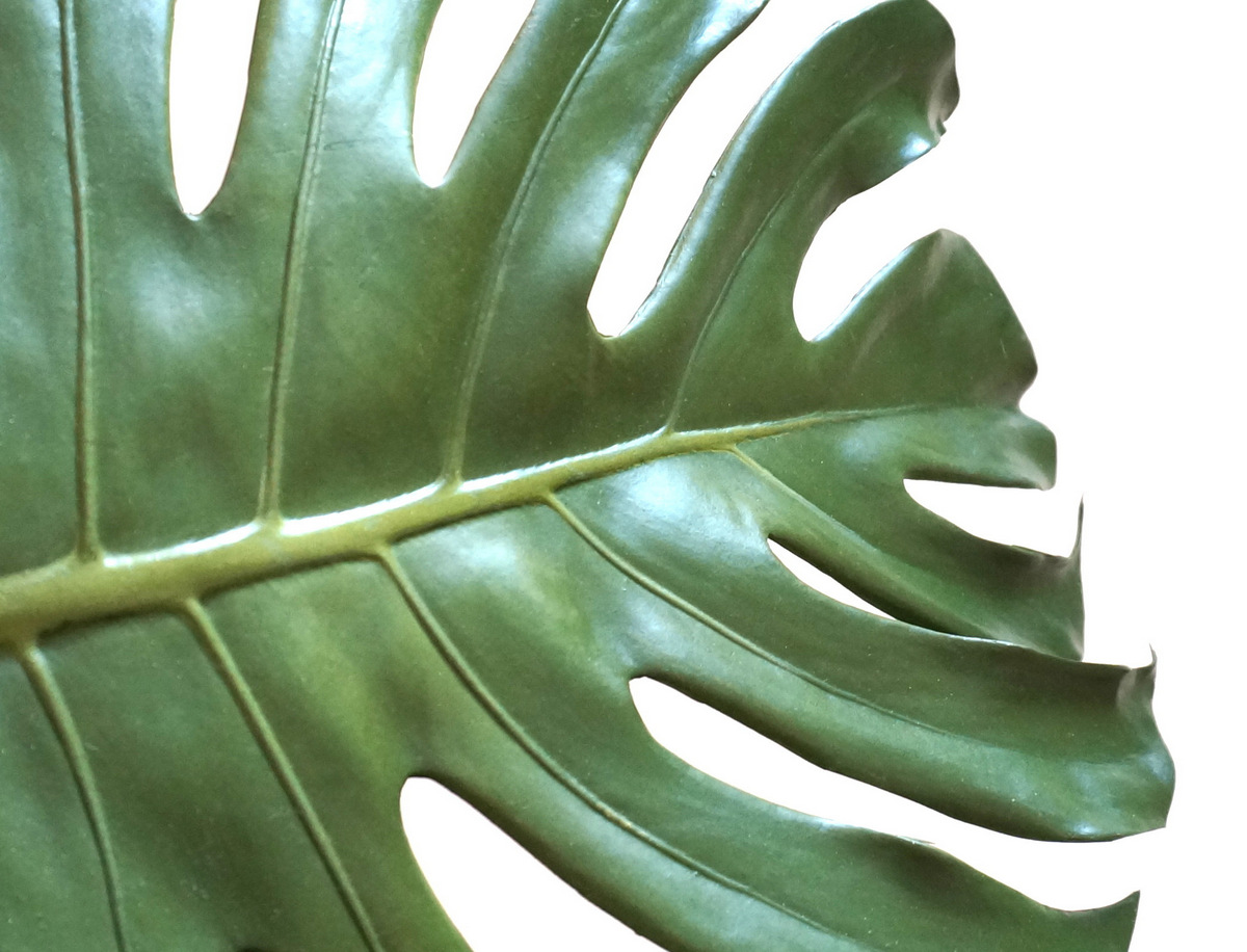 A faux monstera leaf