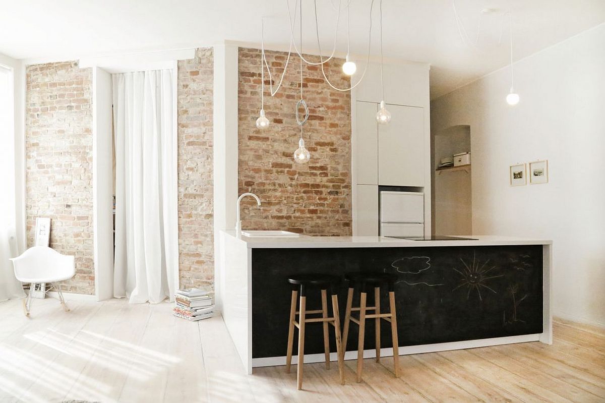 Bright and cheerful kitchen with exposed brick wall