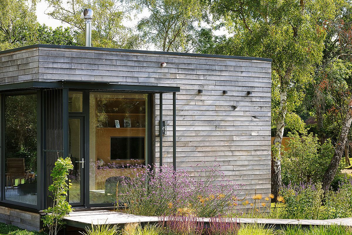 Carefully crafted entrance to the forest house through the green front yard