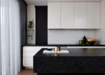 Contemporary-kitchen-in-white-with-a-black-stone-island-217x155