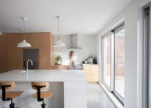 Contemporary-kitchen-in-white-with-wooden-cabinets-and-smart-island-217x155