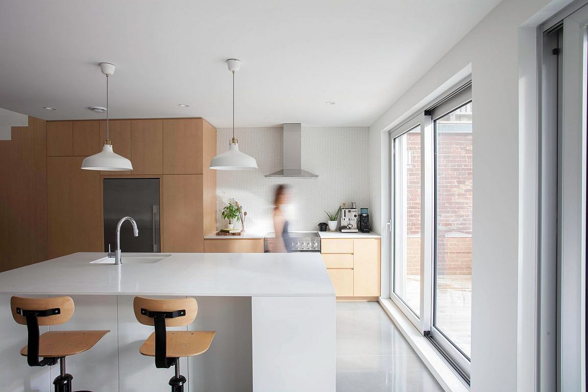 Contemporary kitchen in white with wooden cabinets and smart island