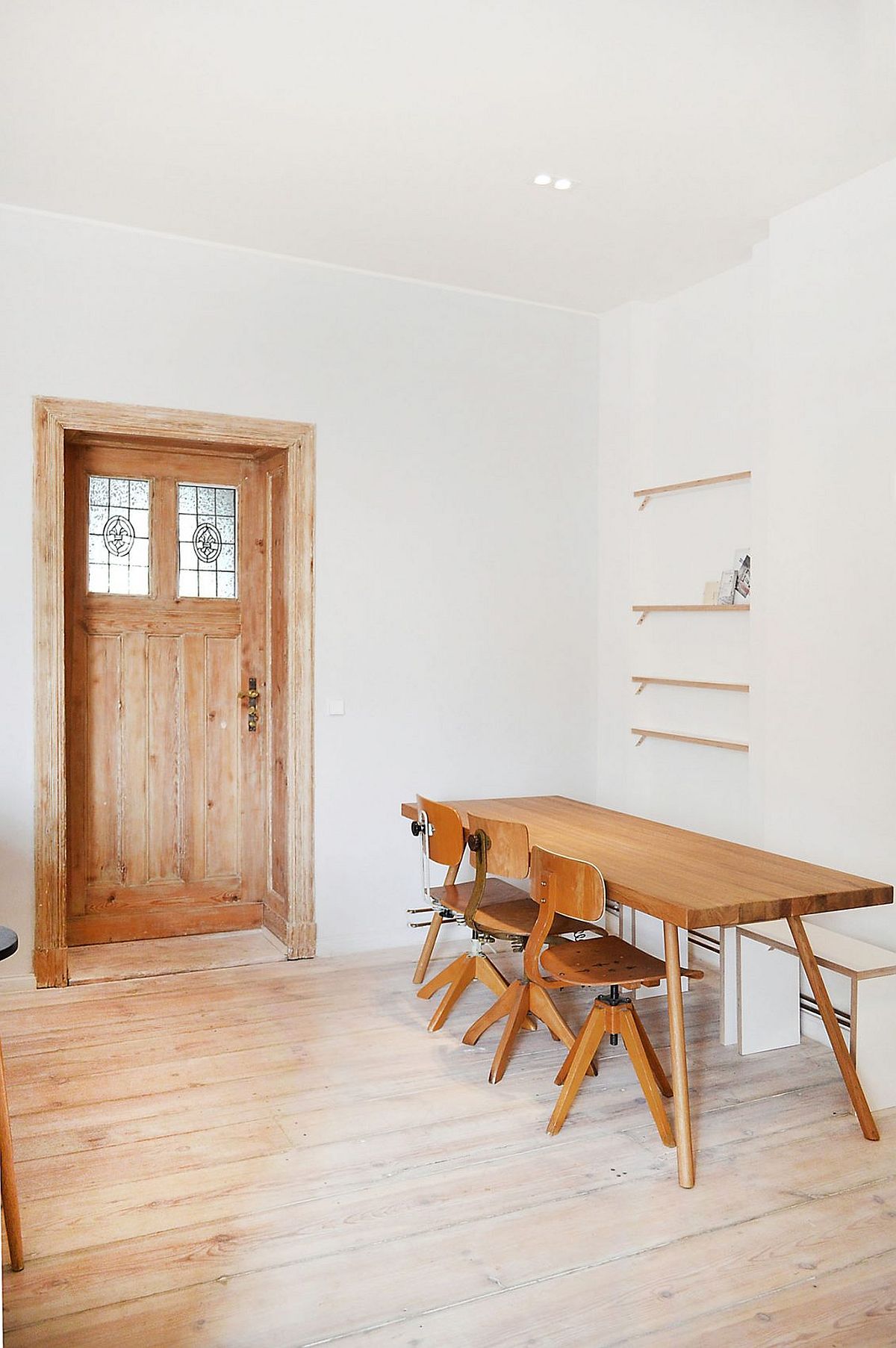 Custom dining table and chairs of the Berlin Apartment