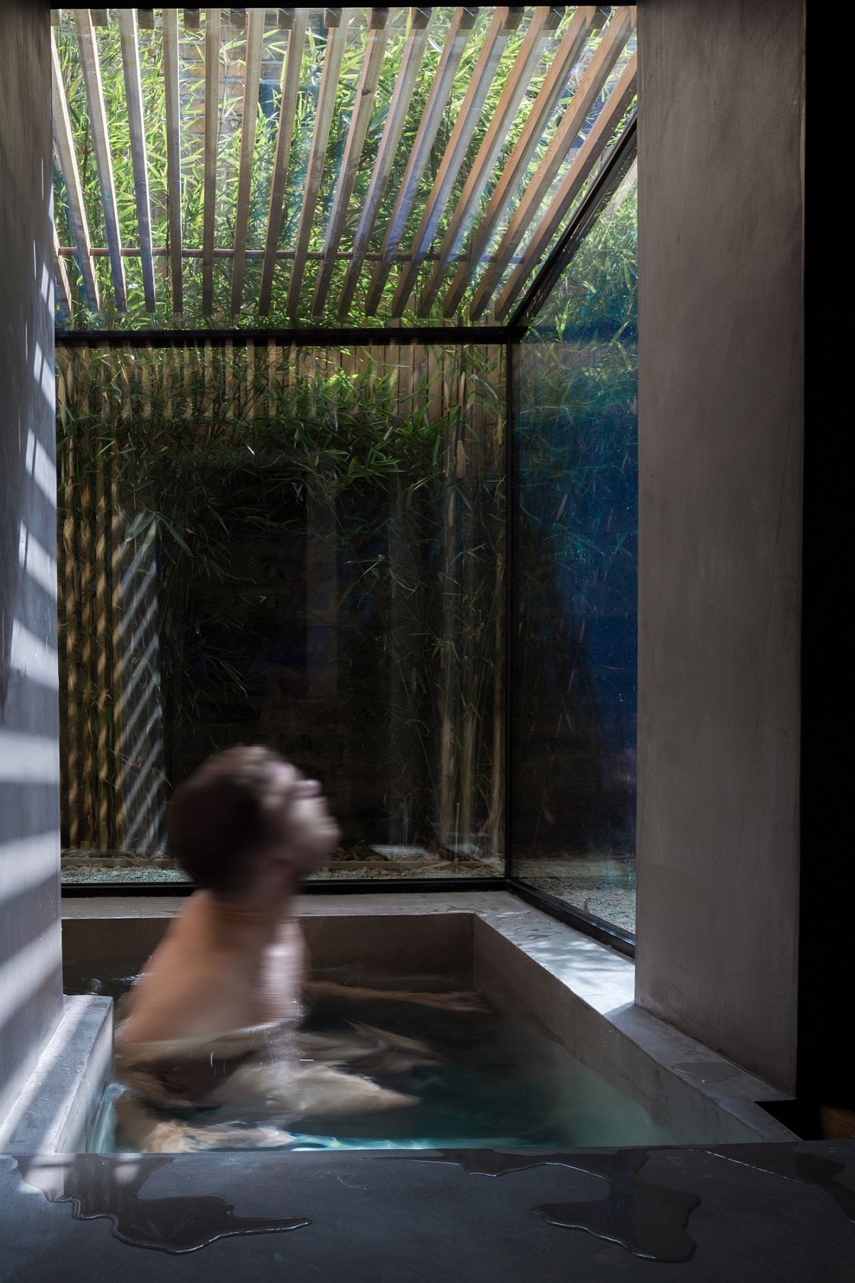 Custom sunken bath for the London home with garden view