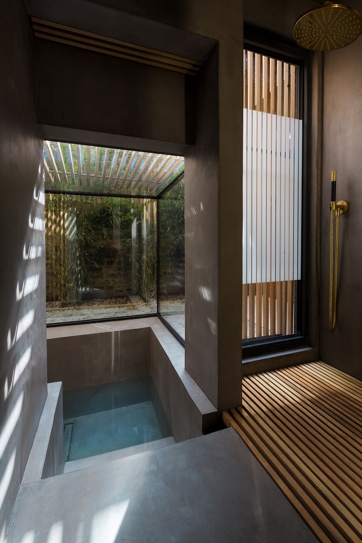 Fabulous glass wall sunken bath with slatted larch screen