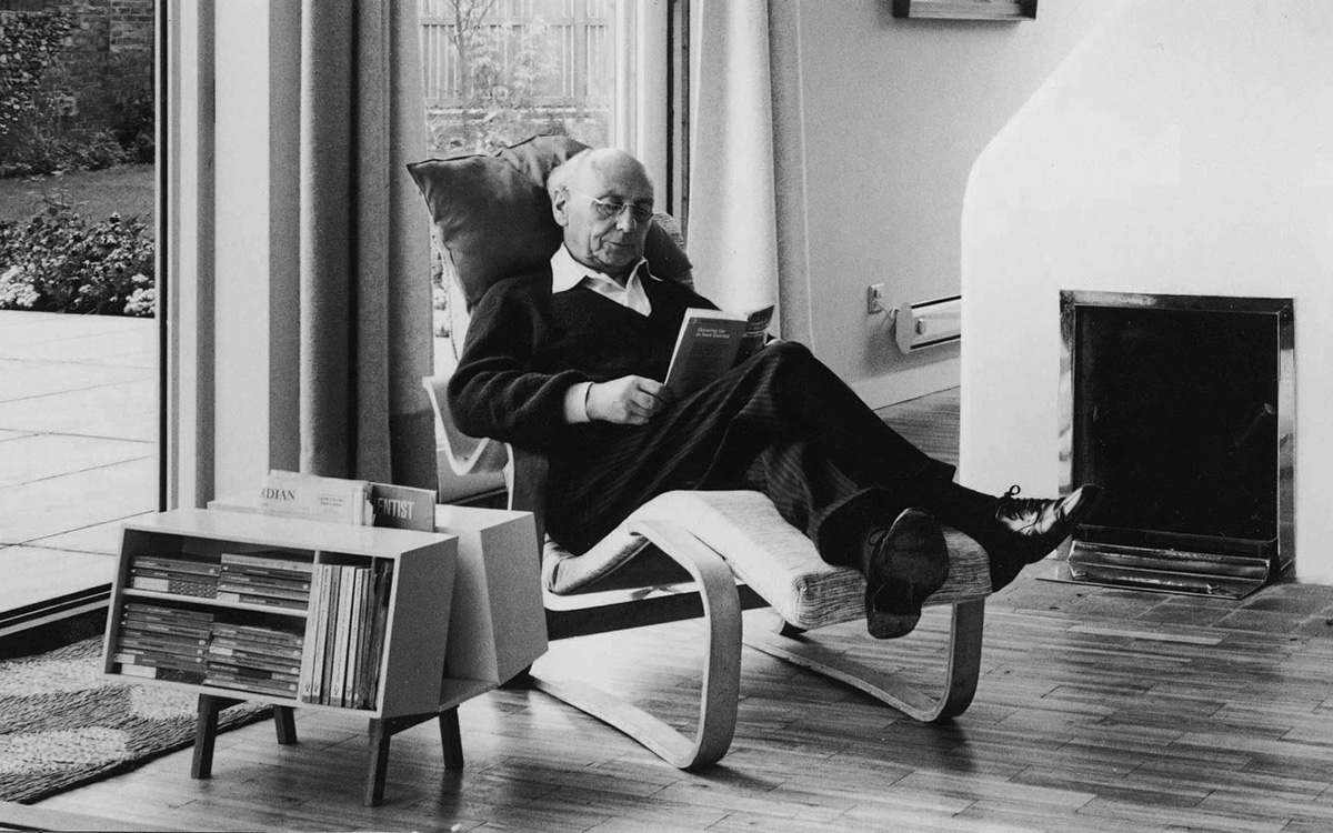 Jack Pritchard in Marcel Breuer’s Long Chair with the Ernest Race Isokon Penguin Donkey Mark 2.