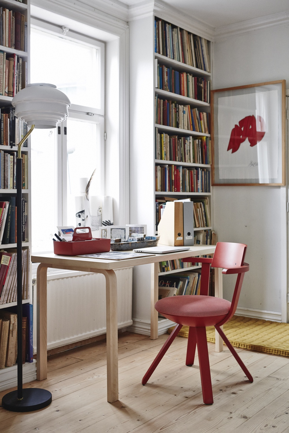 The KC002 Rival Chair (in red) was designed by Konstantin Grcic in 2014. The Vitra Toolbox (in 'brick') was designed by Arik Levy in 2010.