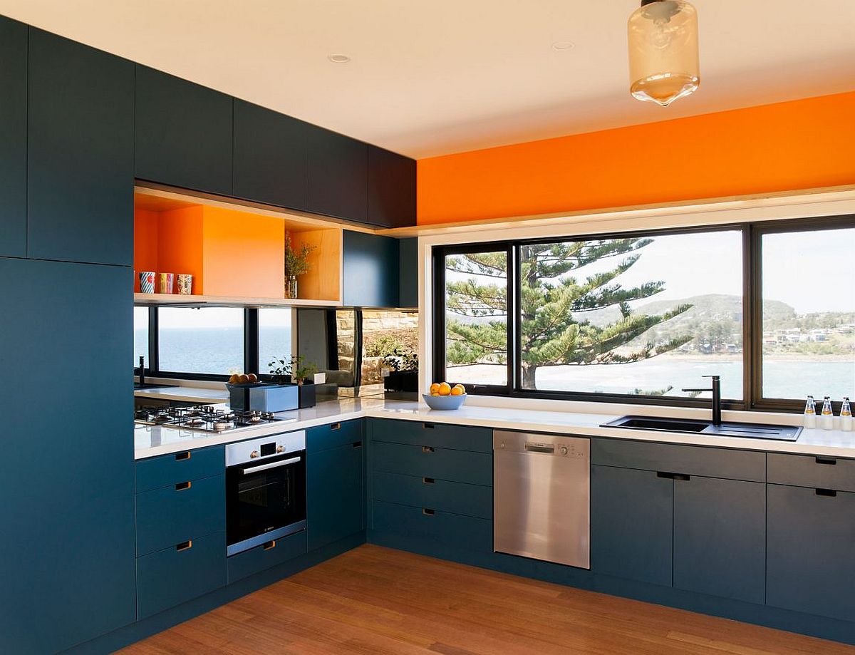 Kitchen in blue and orange with ocean view