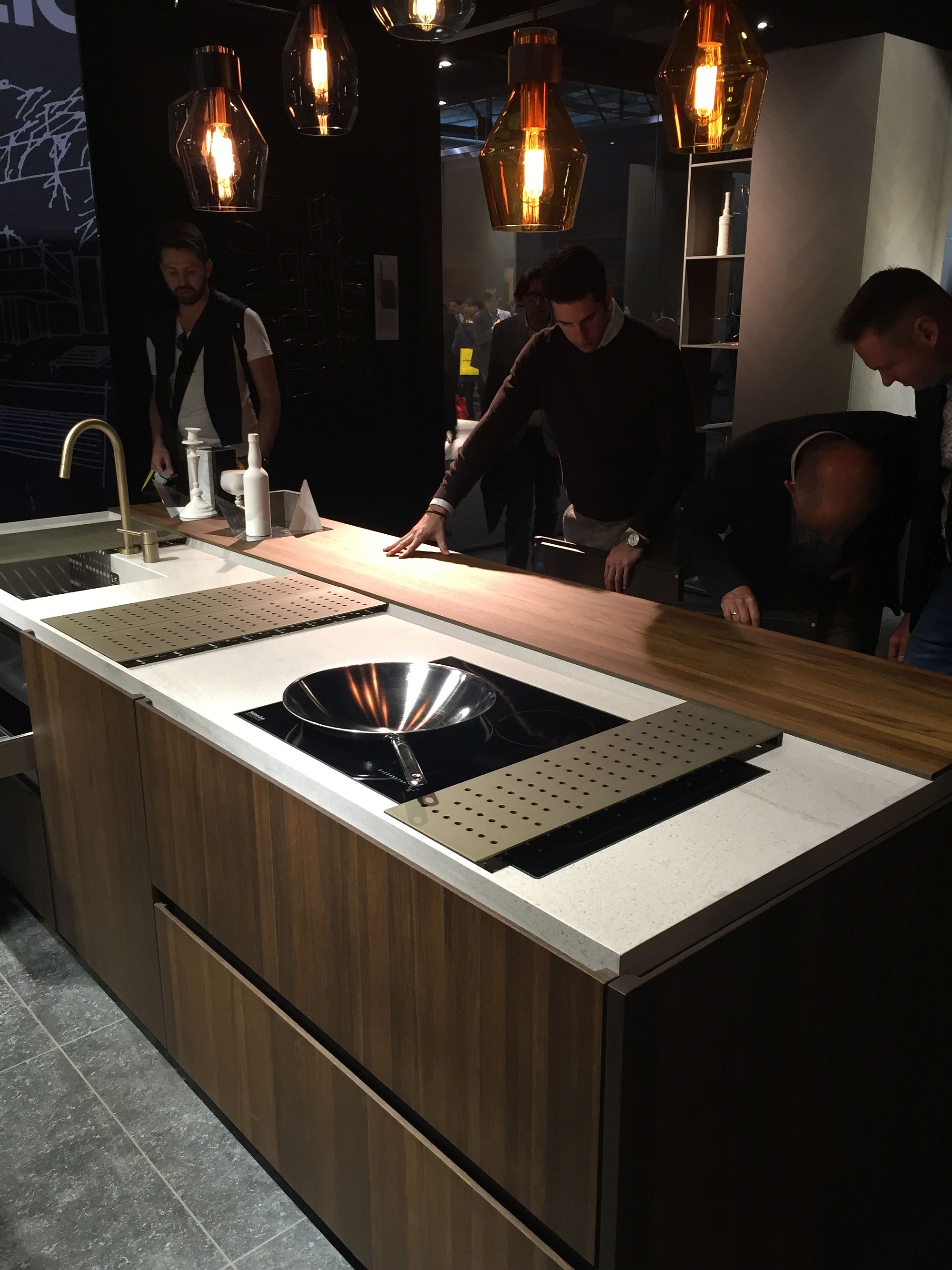 Kitchen island with wooden cabinets becomes focal point of the open living area