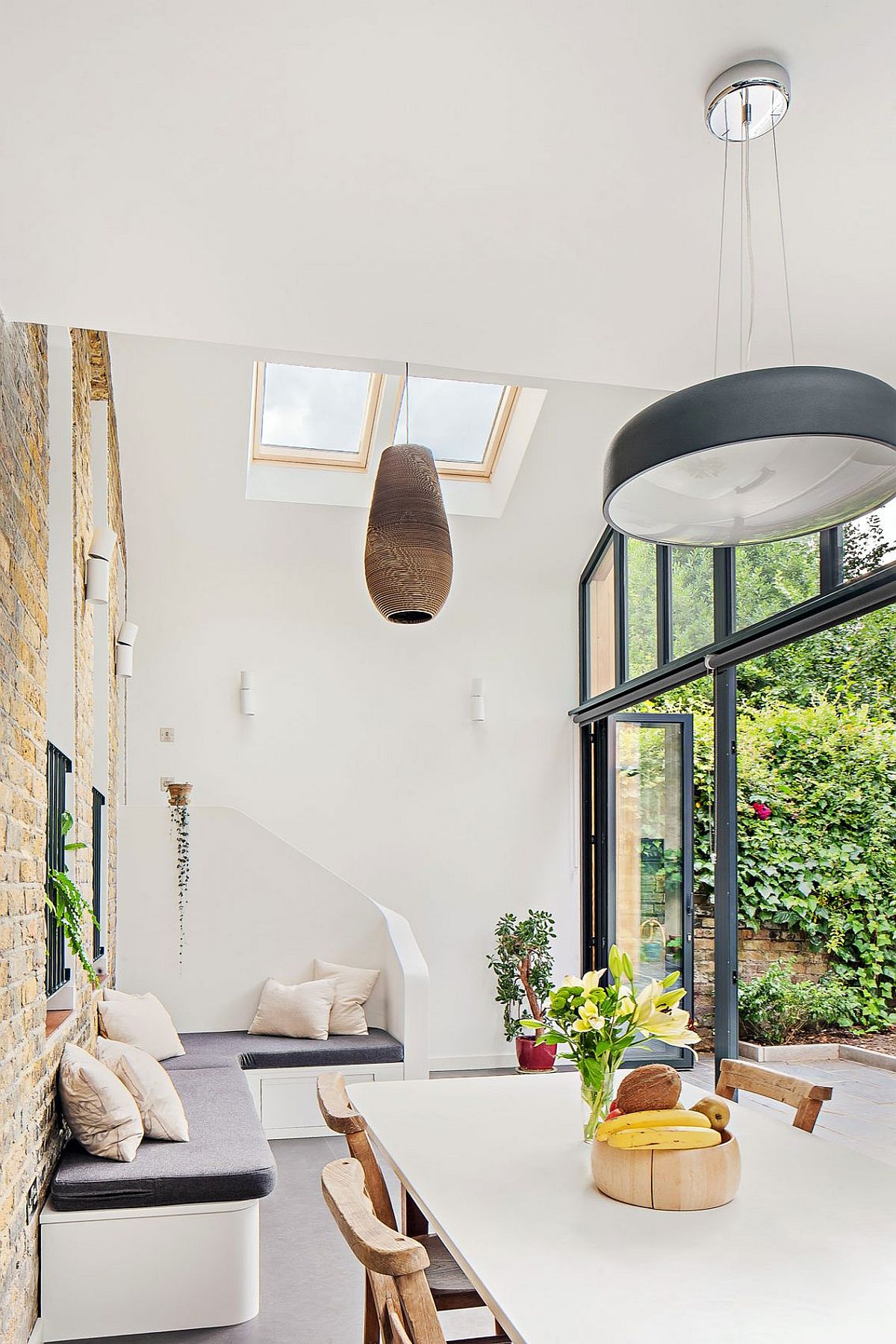 Large dining area of the London home with skylights