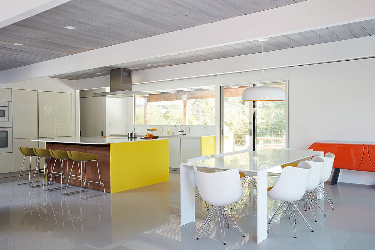 Large kitchen island with a overhang and dining space next to it