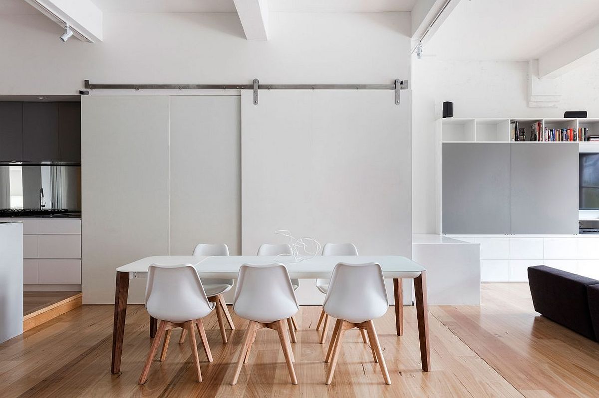 Minimal modern dining room in white with sliding barn style door