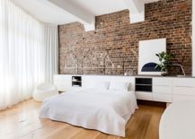 Modern-bedroom-in-white-with-exposed-brick-wall-217x155