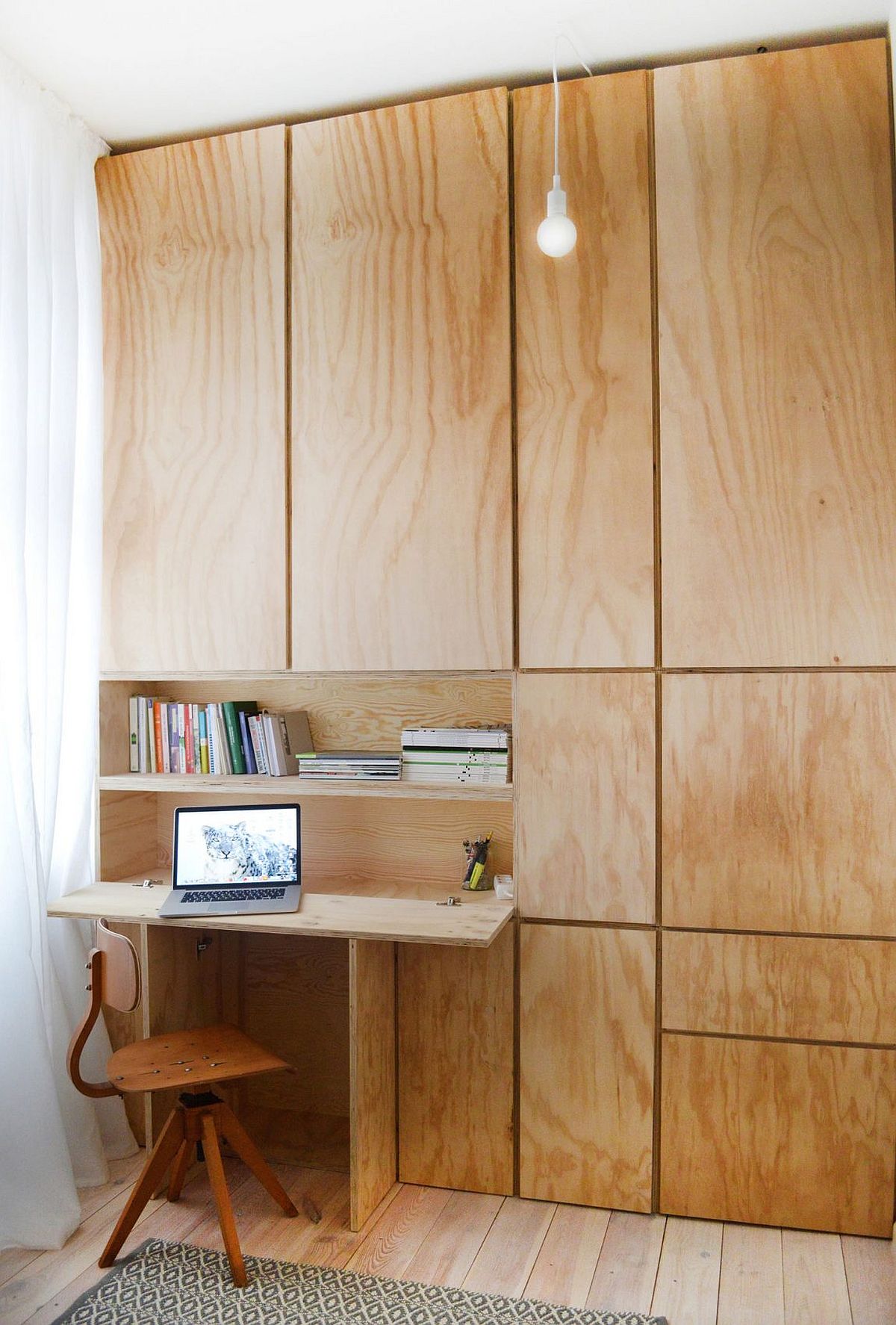 Modern home office with a wall of wood