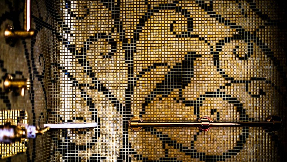 Mosaic bird in gold and black inside the luxury suite at Prince de Galles