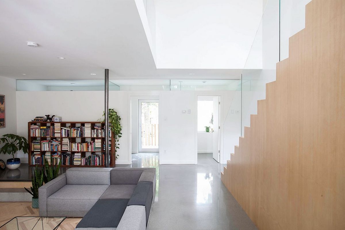 Open and light-filled living area of the Montreal residence with sunken living zone