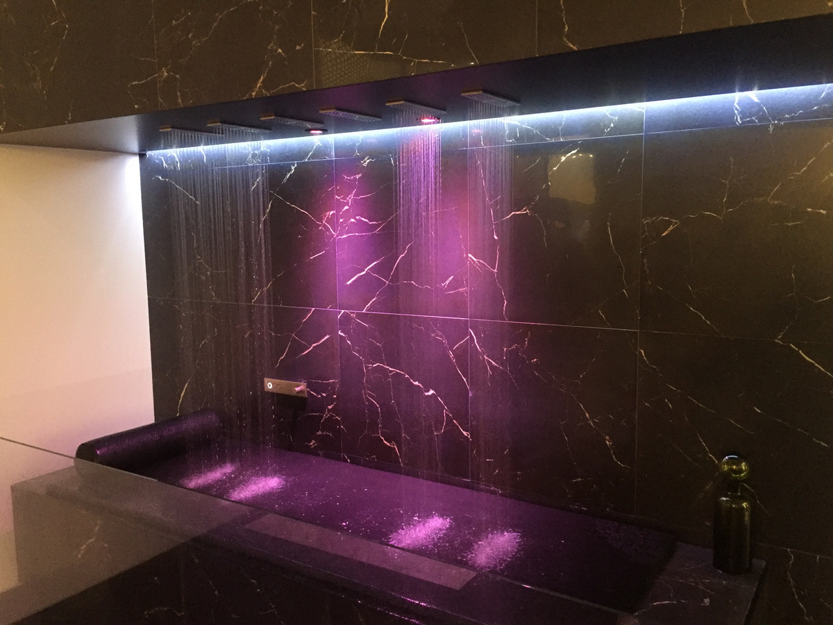 Pink lighting in a modern powder room