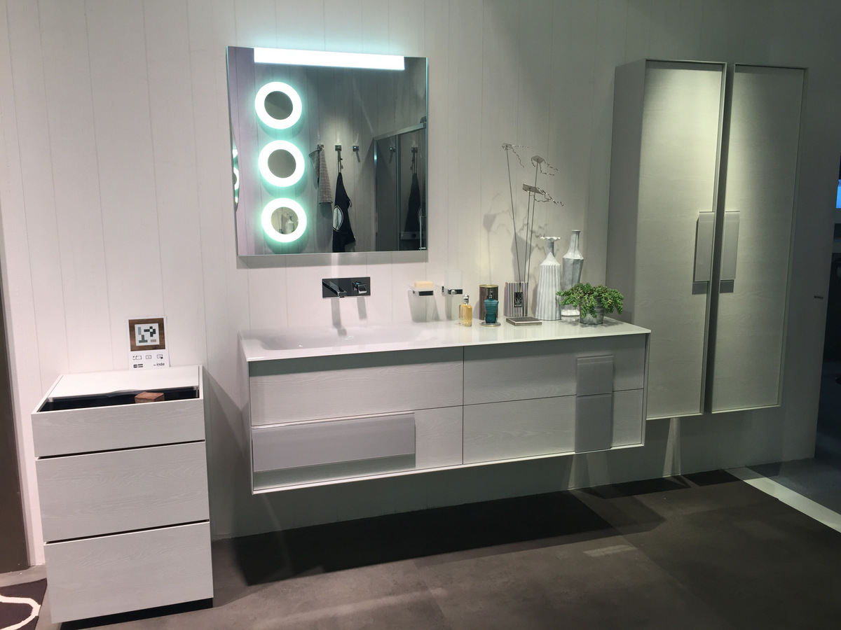 Pops of green in a white powder room