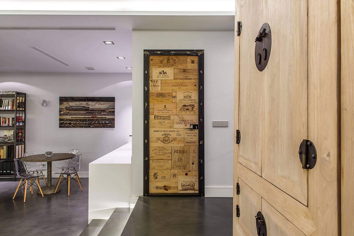 Reclaimed wood used to craft a unique door in the industrial setting