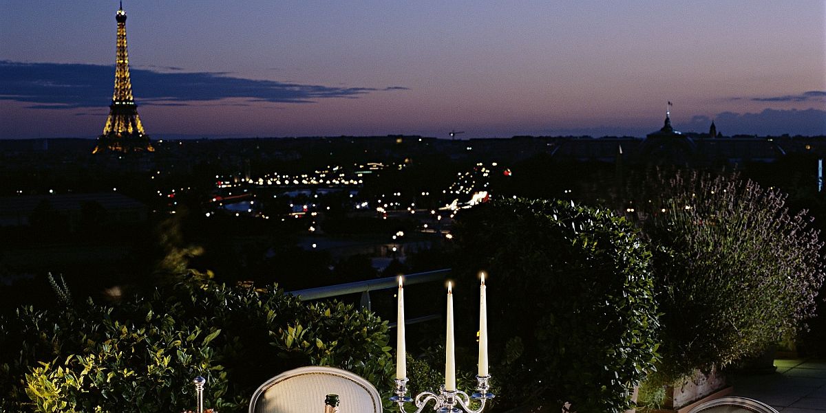 Romantic dinner on the balcony of luxury French hotel with a view of the Eiffel Tower