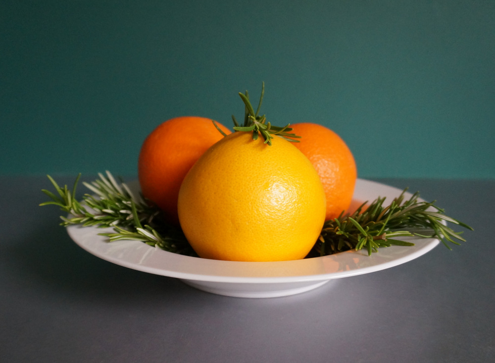 Rosemary and oranges make a lovely centerpiece