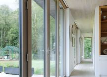 Series-of-glass-doors-connects-the-indoors-with-the-deck-outside-217x155