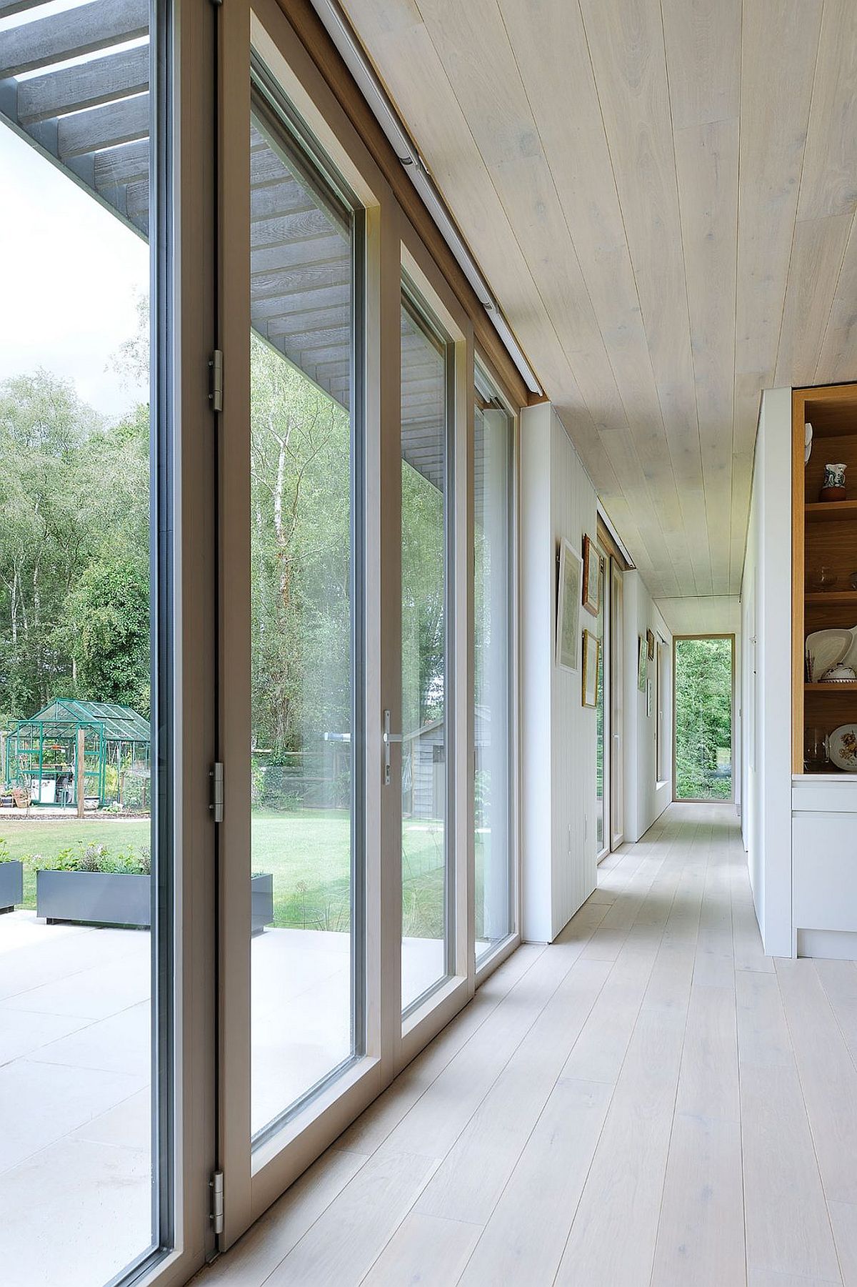 Series of glass doors connects the indoors with the deck outside