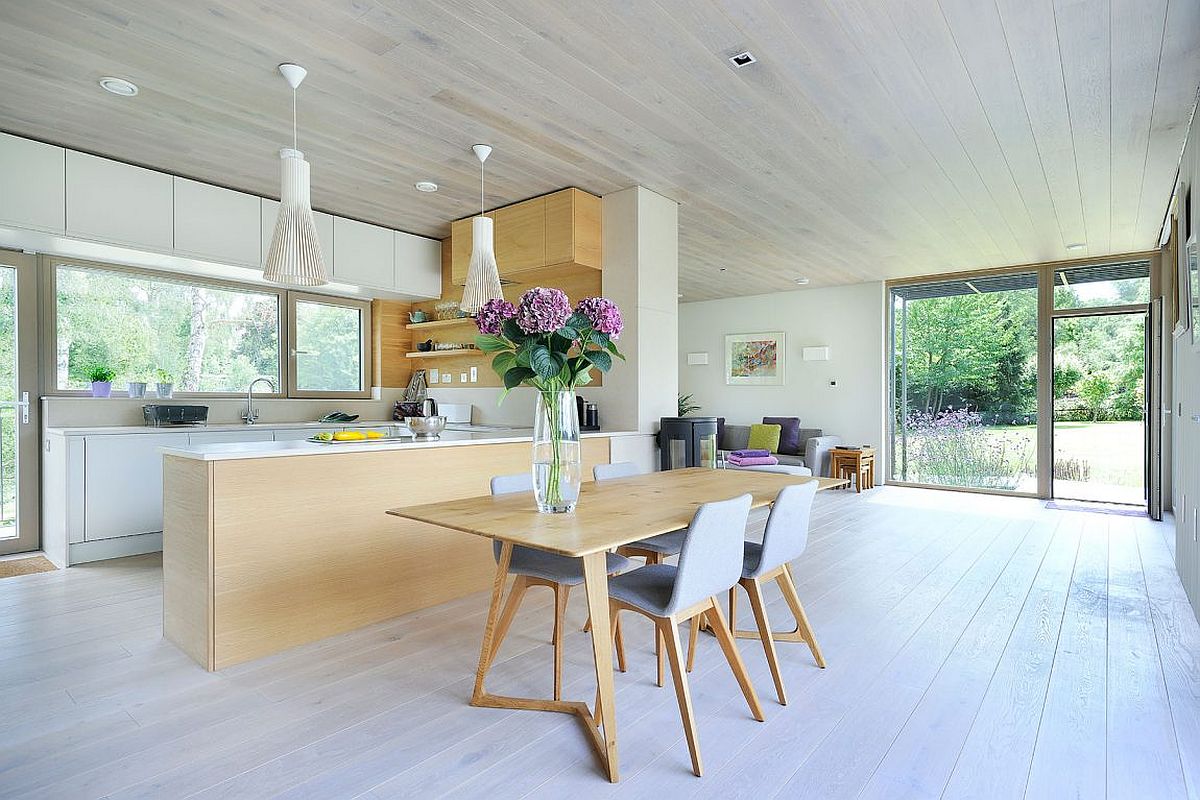 Small dining space with rectangular table and four comfy chairs