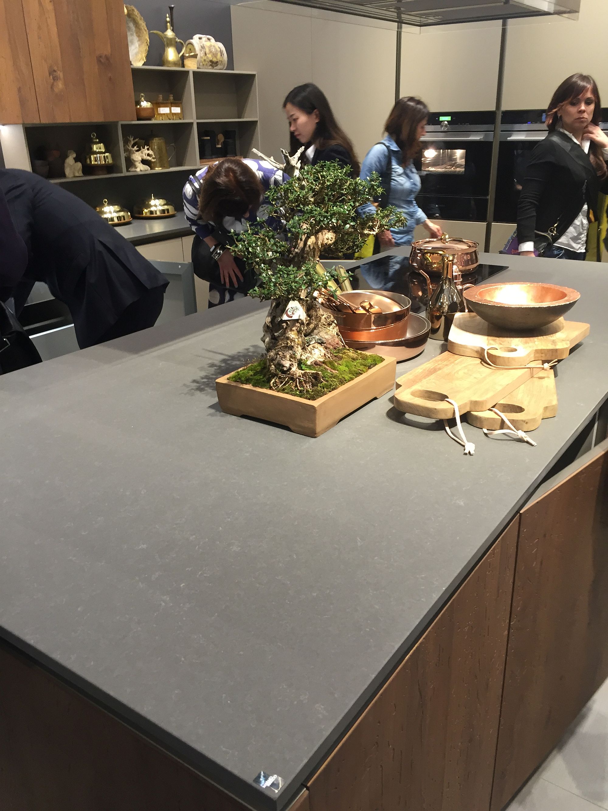 Stylish kitchen island with smart worktop and wooden cabinets