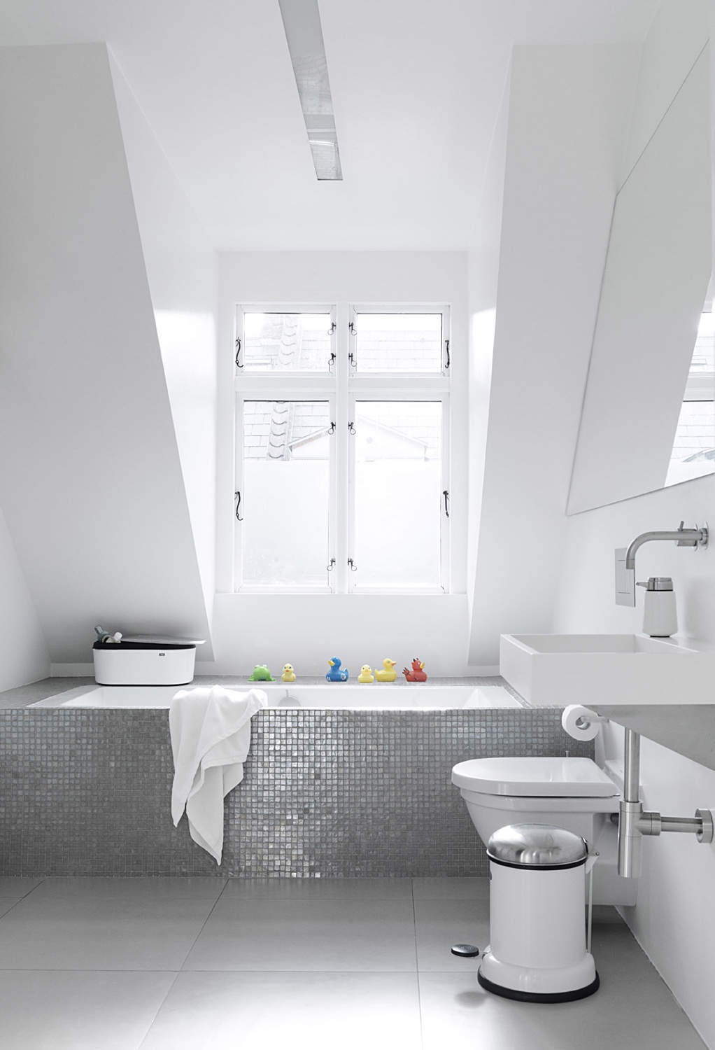 Vipp products bathroom, including the Vipp pedal bin and soap dispenser. Image © Vipp.