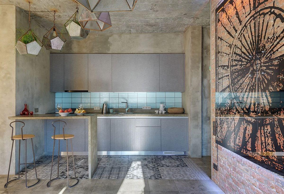 Wooden cabinets and blue backsplash bring warmth to the small kitchen