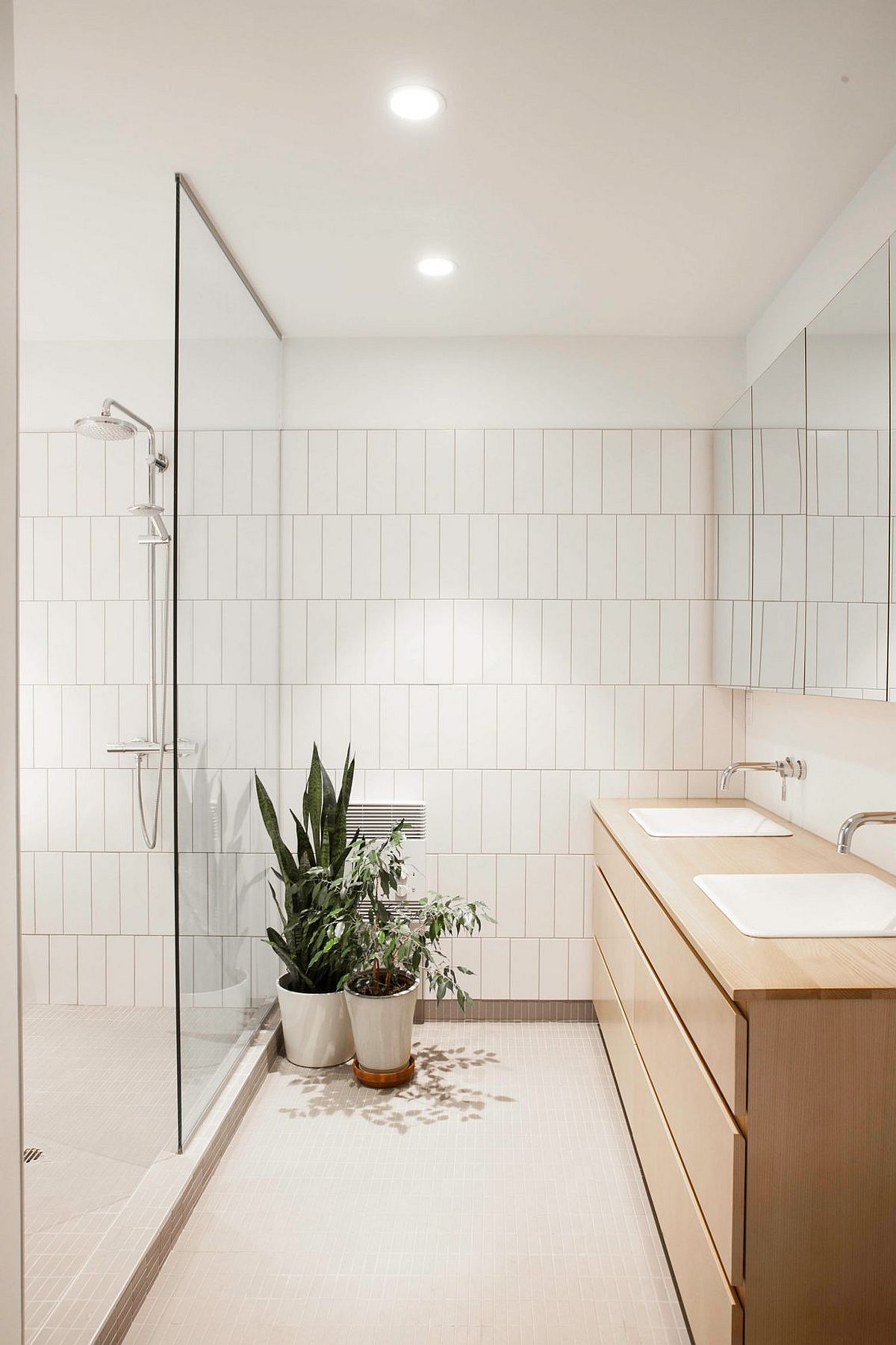 Wooden vanity for the light-filled bathroom in white