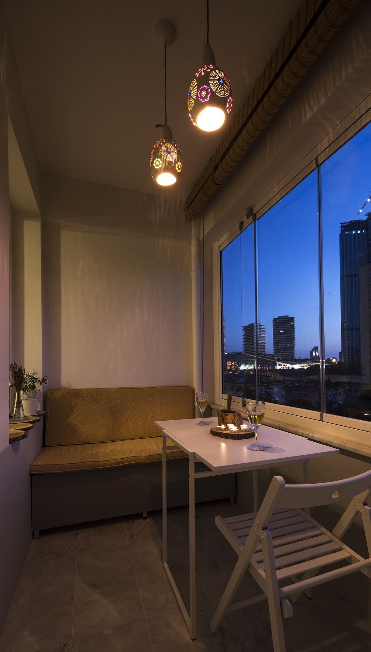 Balcony with city views and a small sitting area