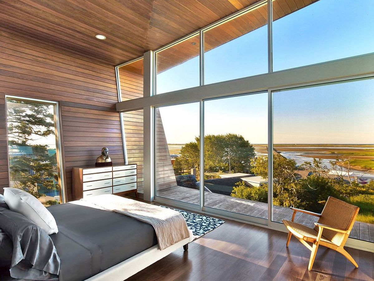 Bedroom with sliding glass doors maximizes view of the beachy landscape