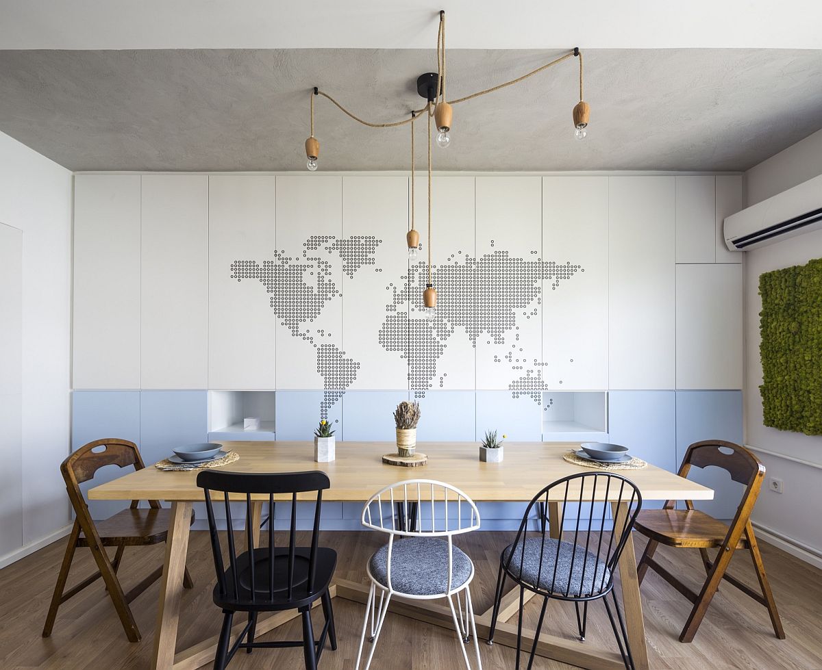 Blue and white dining room with lovelu backdrop of the world map