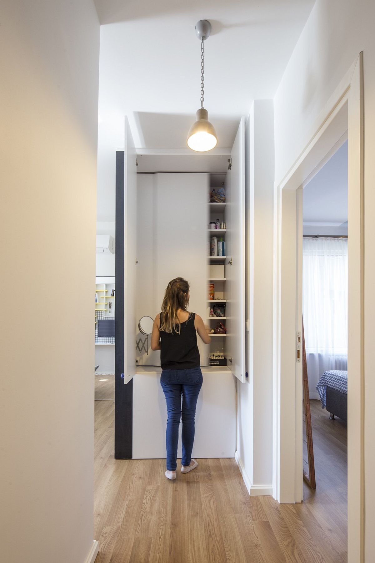 Cabinets and closed shelves give the apartment an organized look