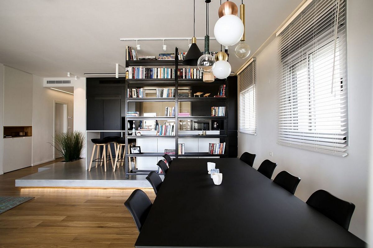 Combination of contrasting pendant lights above the dining table