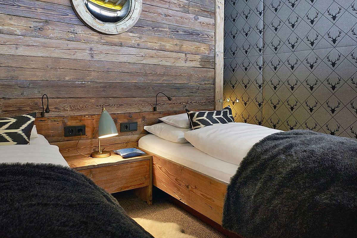 Cozy cabin style bedrooms of the lavish chalet