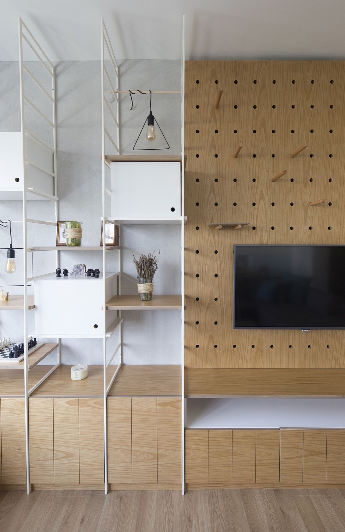 Custom shelves and cabinets next to the TV unit with mouldar style