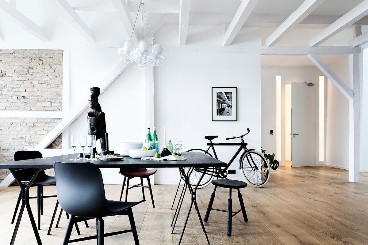 Dining area of the Berlin loft with industrial chic style