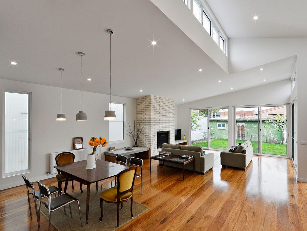 Double height interior of the revamped Melbourne home with a cheerful dining area