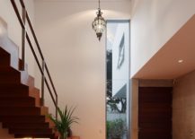 Double-height-lower-level-of-the-house-gives-the-interior-an-airy-vibe-217x155