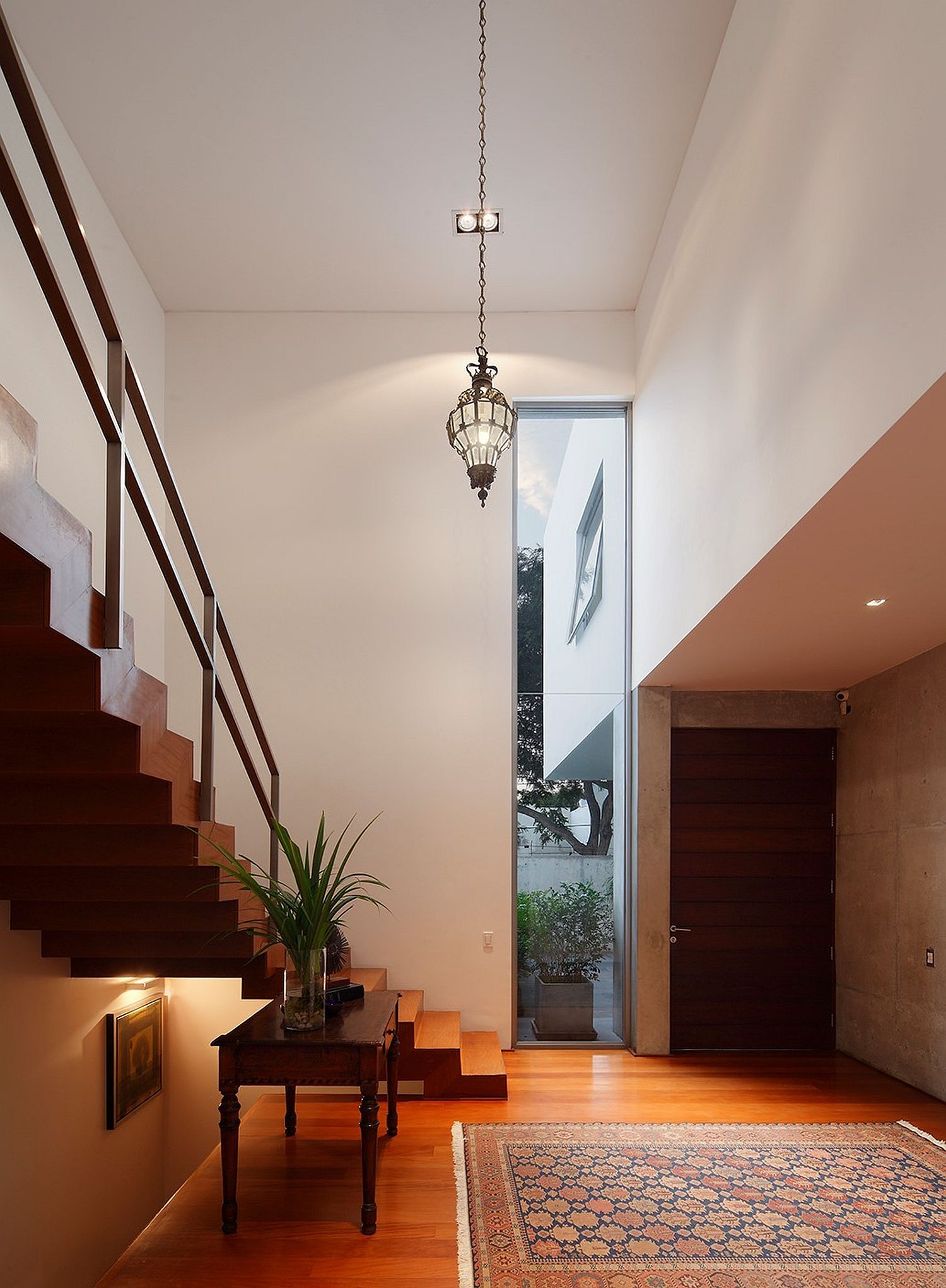 Double height lower level of the house gives the interior an airy vibe